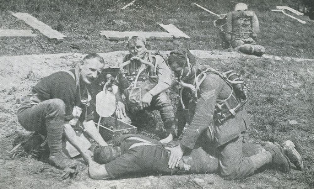 Reviving a victim of gas by using a 'Novita' pure oxygen apparatus, at a Mine Rescue School. 